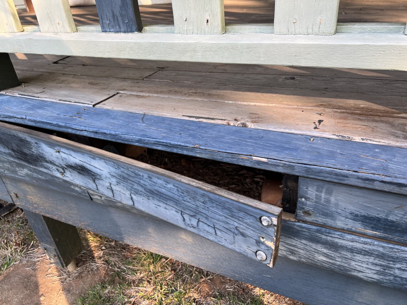 A deck with damaged boards
