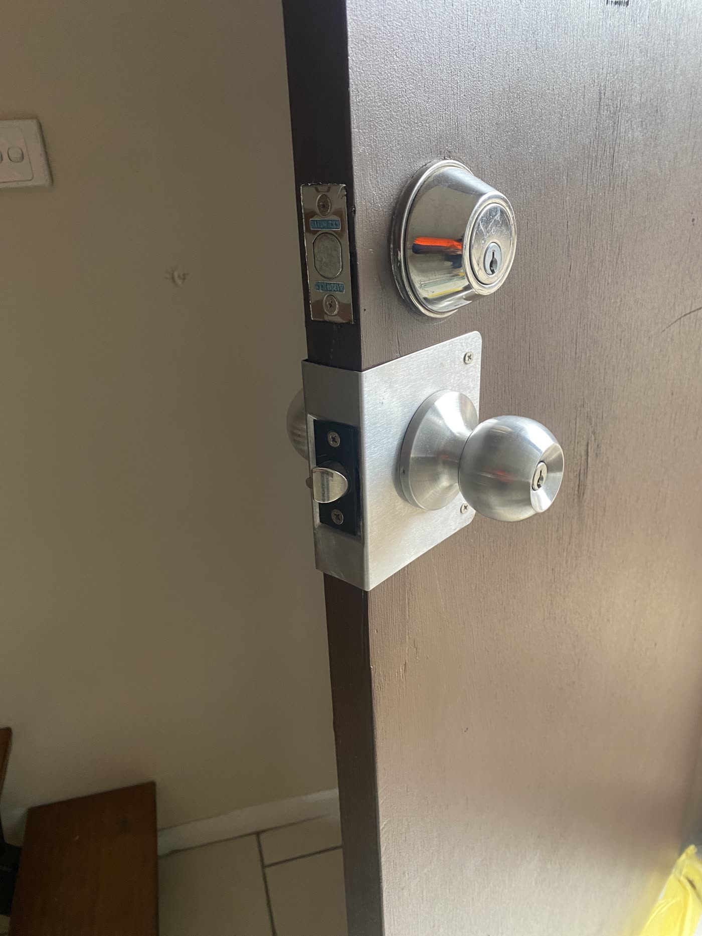 The same door repaired with new strike plates