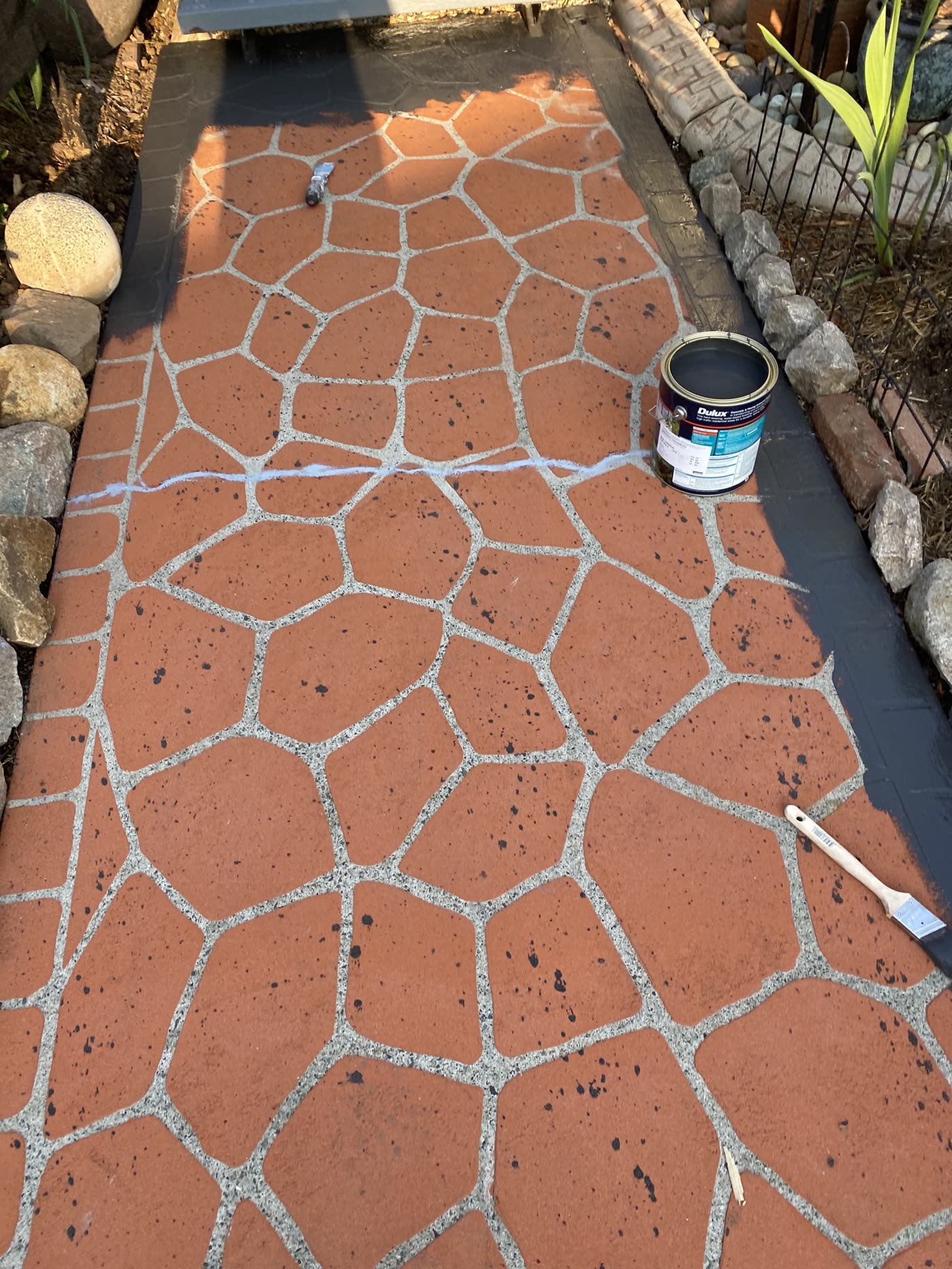 A tired, stained path and driveway