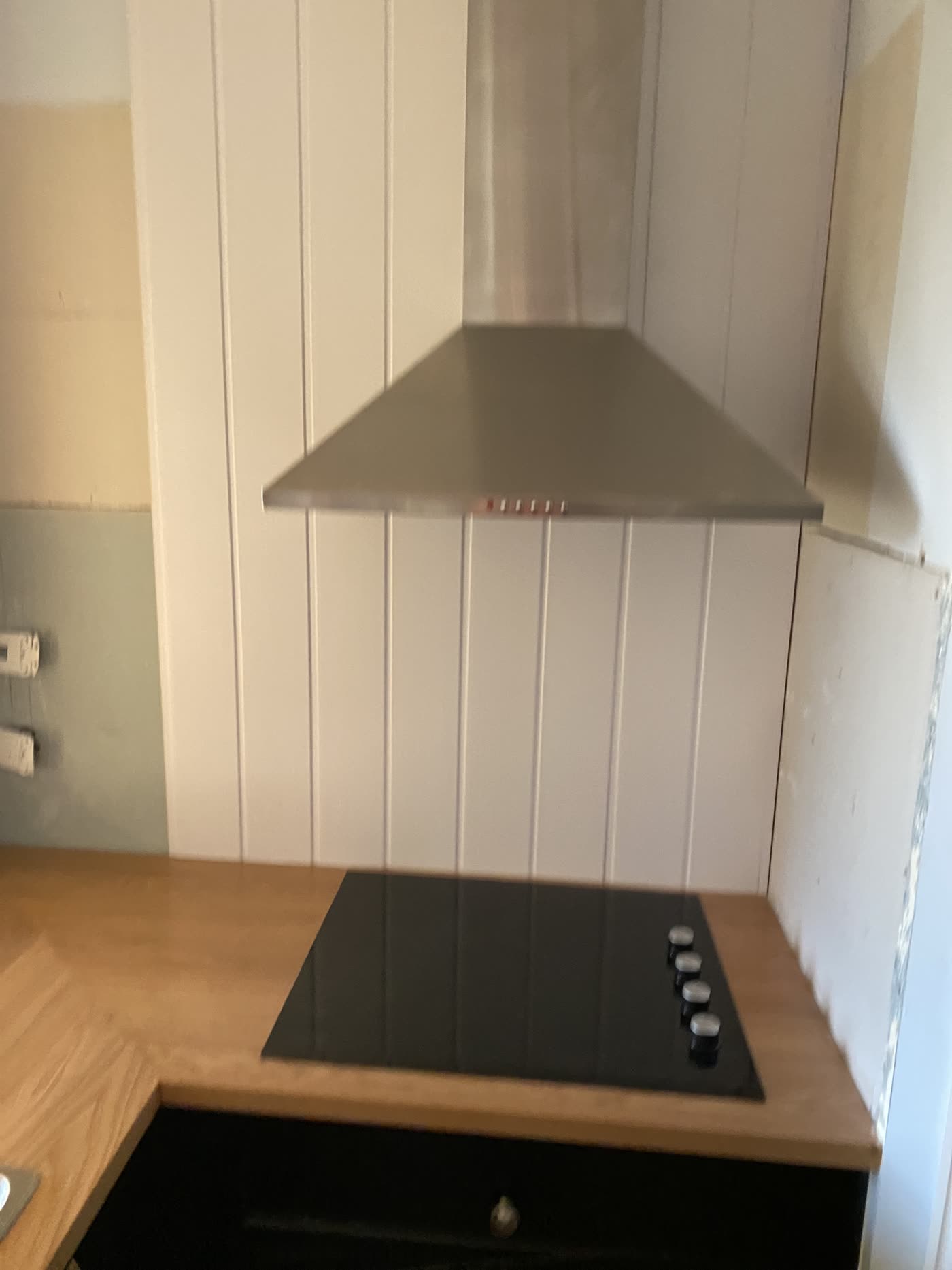 VJ panelling fitted as a splashback on the same wall