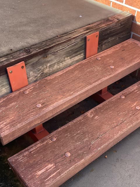A staircase with worn treads