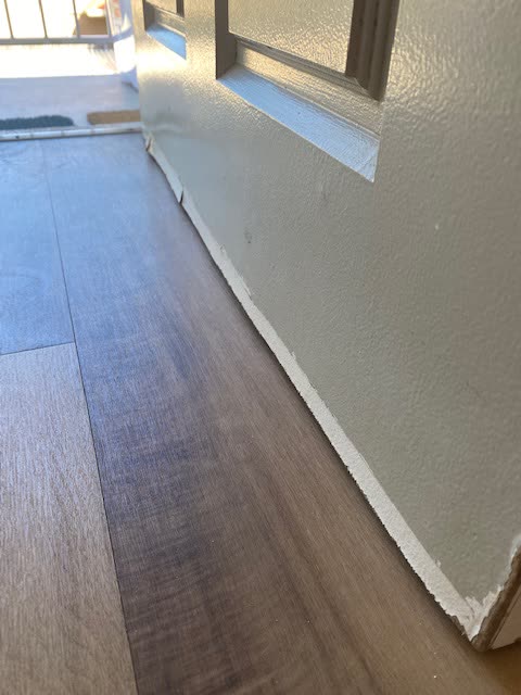 The base of an entry door with a draught gap