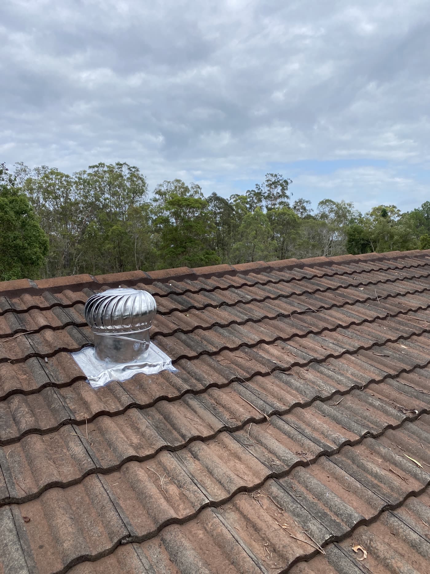 A whirlybird vent installed on the same roof